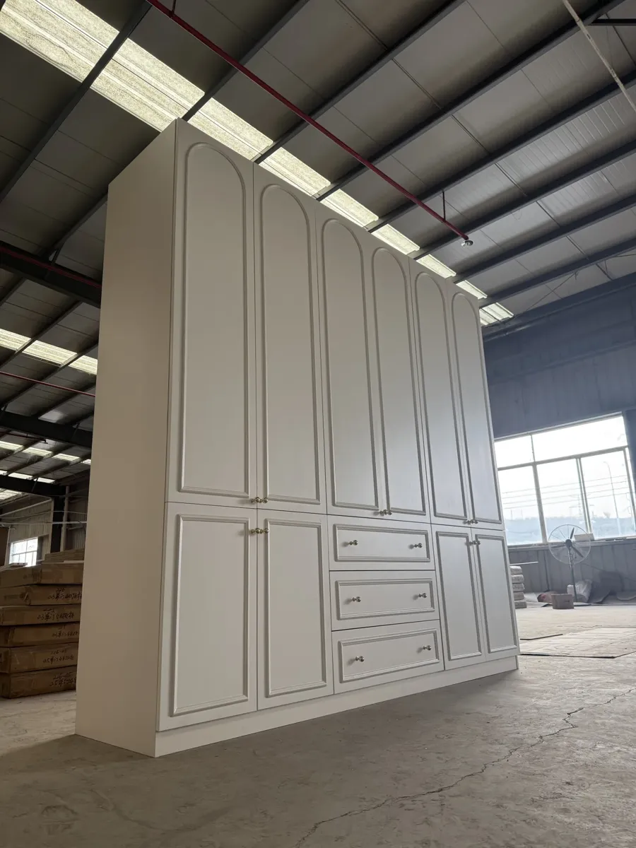 The factory's 2.4 m French-style wardrobe from another angle. The maker offers sizes and door counts as combinations of existing units, not new.
