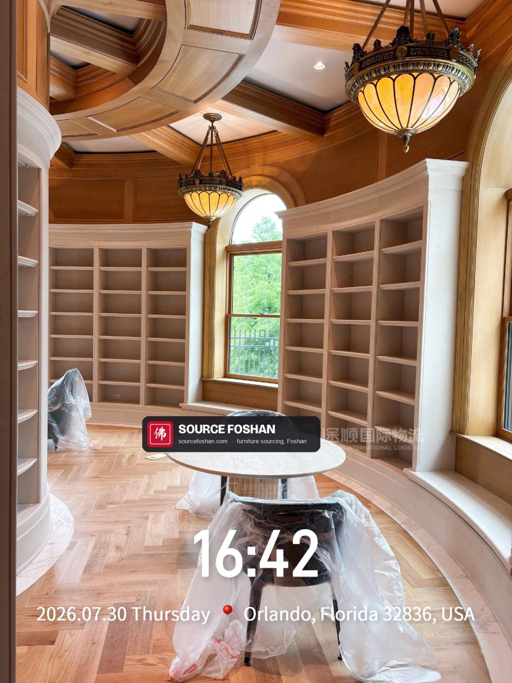 Round marble table in the curved library, 16:42
