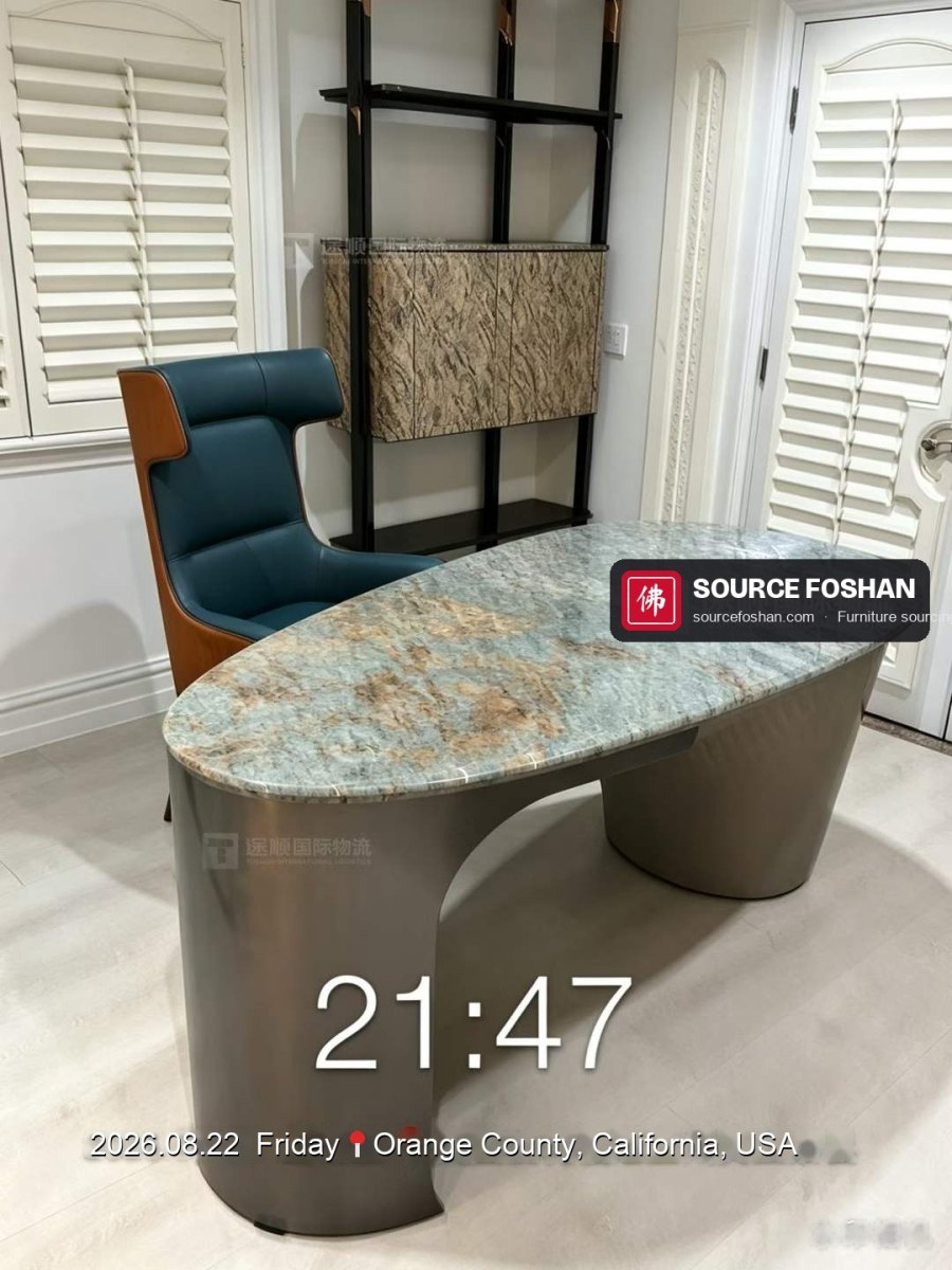 Marble-top desk and leather chair from Foshan installed in a California home office