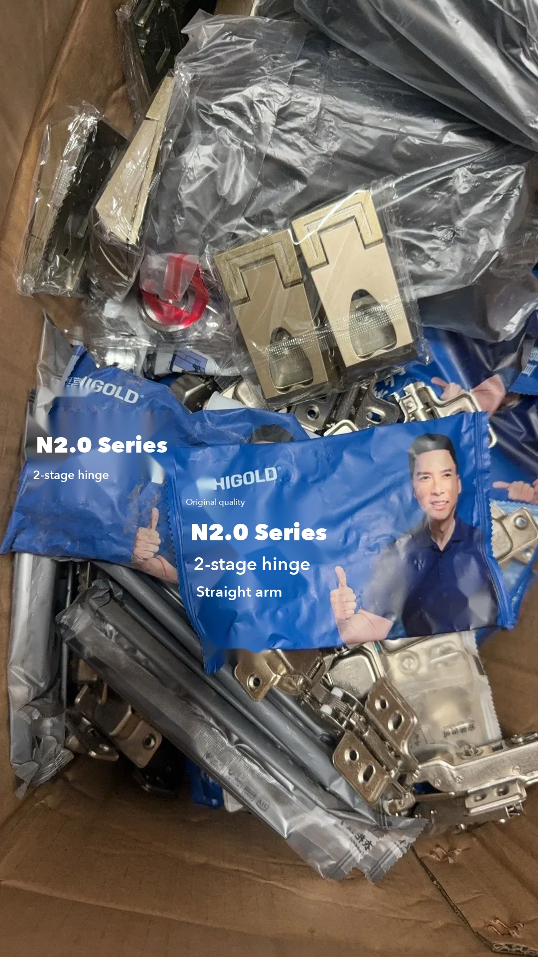 The hardware box opened on delivery: the buyer checked that every hinge was the branded two-stage soft-close model named in her contract, not a.