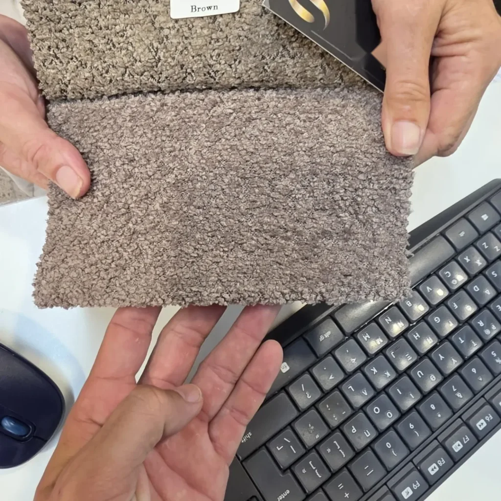 Comparing two bouclé swatches side by side, from a Zhejiang-based agent's post. Turning a photo into a written spec means naming the exact fabric and.