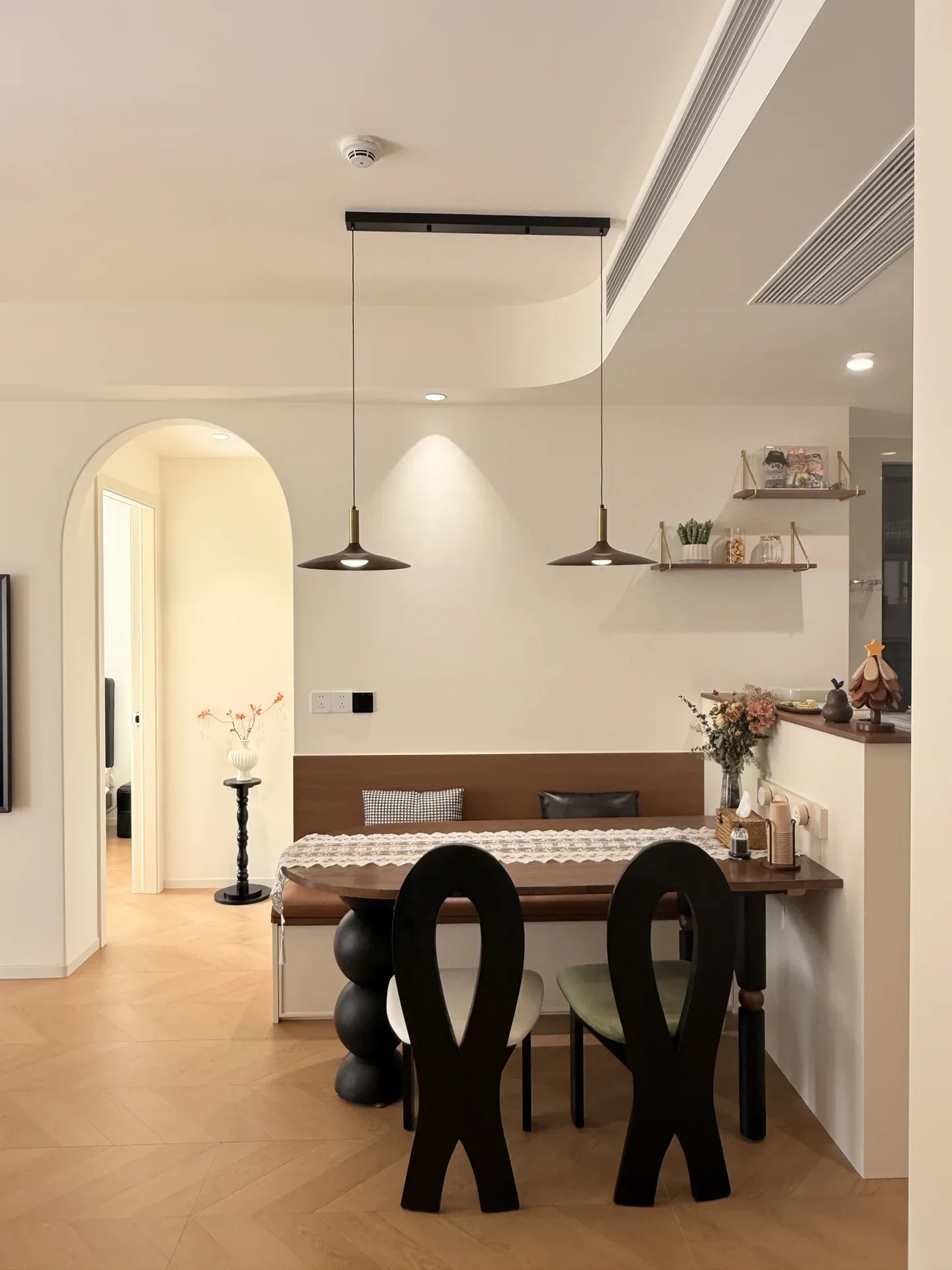 A homeowner's built-in dining booth with a leather-look seat pad and storage base. Restaurants order the same idea as freestanding factory-built.