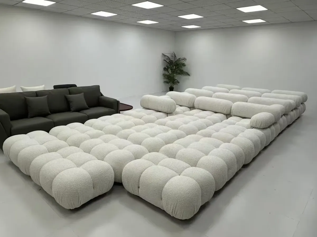 A modular sofa in a showroom. The tufting depth and seam lines are where cheap versions show first.