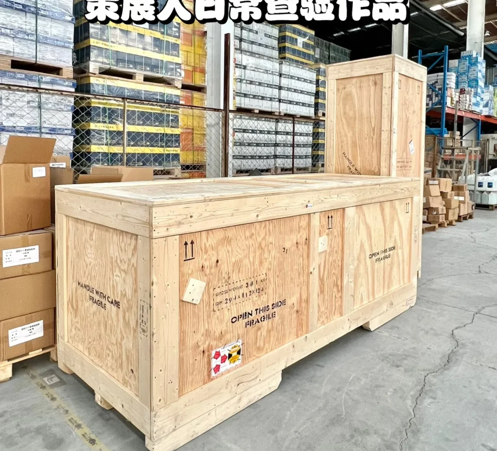 Crated furniture from several Foshan suppliers stacked in the Source Foshan consolidation warehouse before loading
