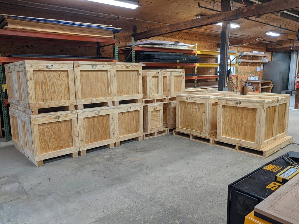 Unrelated plywood shipping crates illustrating packaging ownership