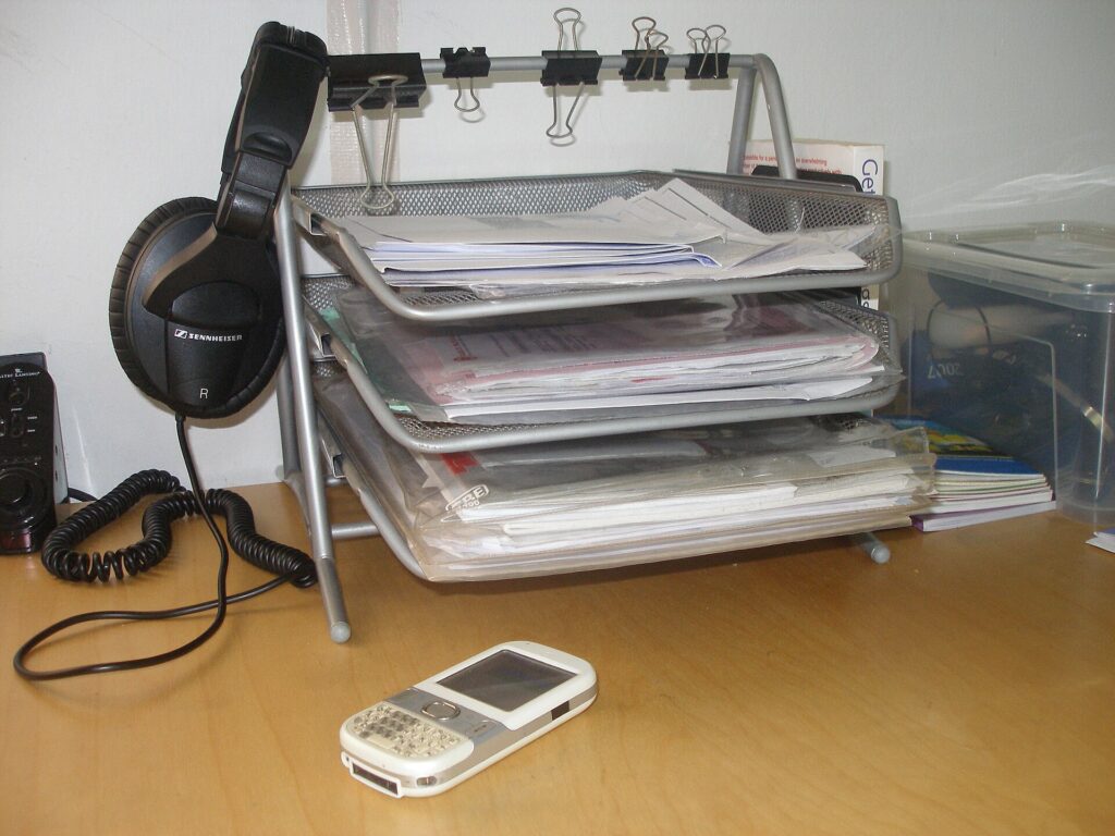 Unrelated document trays illustrating retention of raw quotes and the comparison register