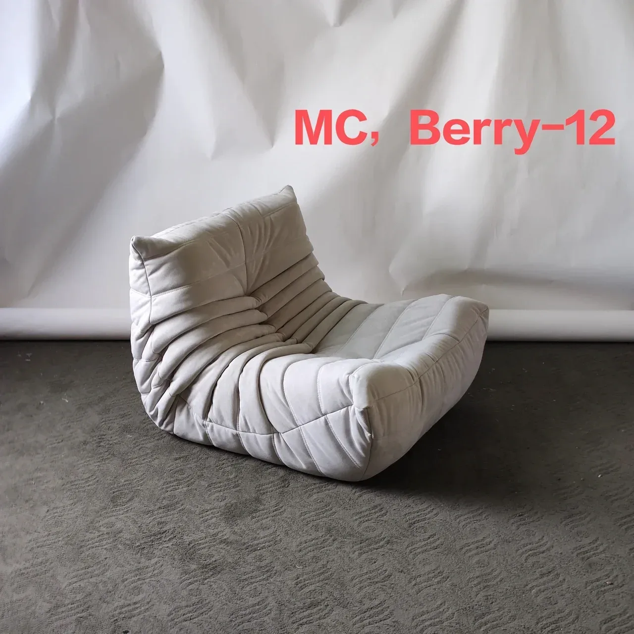 A photo from the same order showing the chair labelled with its fabric code, MC Berry-12. A labelled photo lets you check the colour against the.