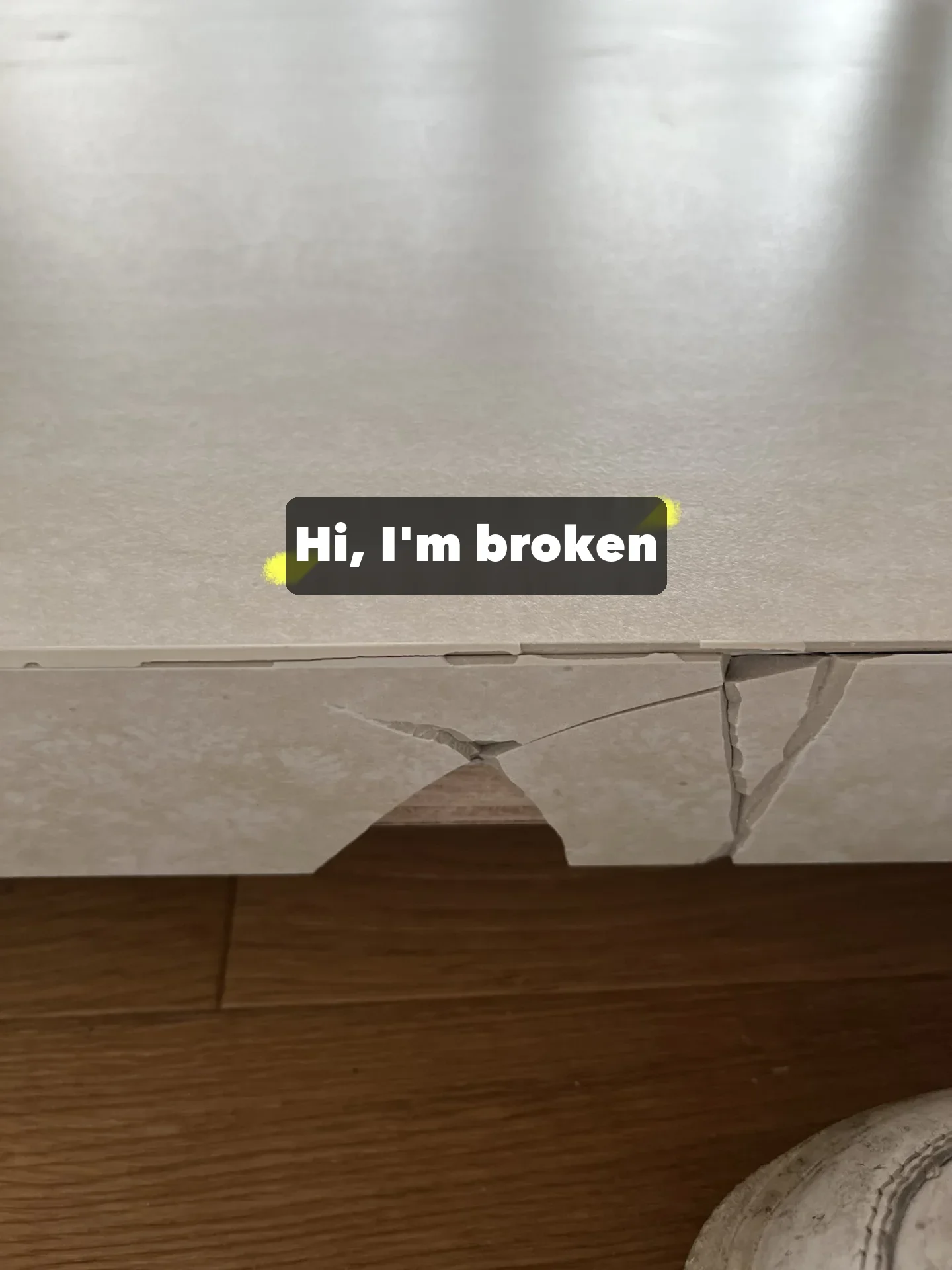 A stone tabletop that cracked in transit; stone and glass need a full crate, not just a carton.
