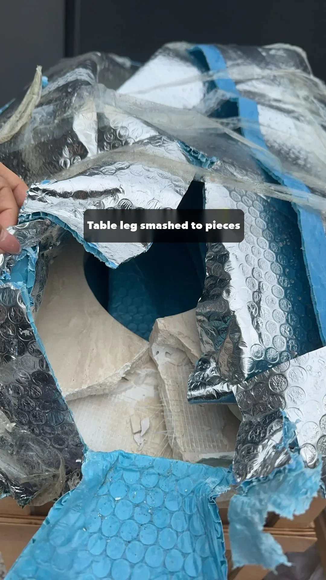 From the same Perth shipment: a table leg shattered inside its bubble wrap.