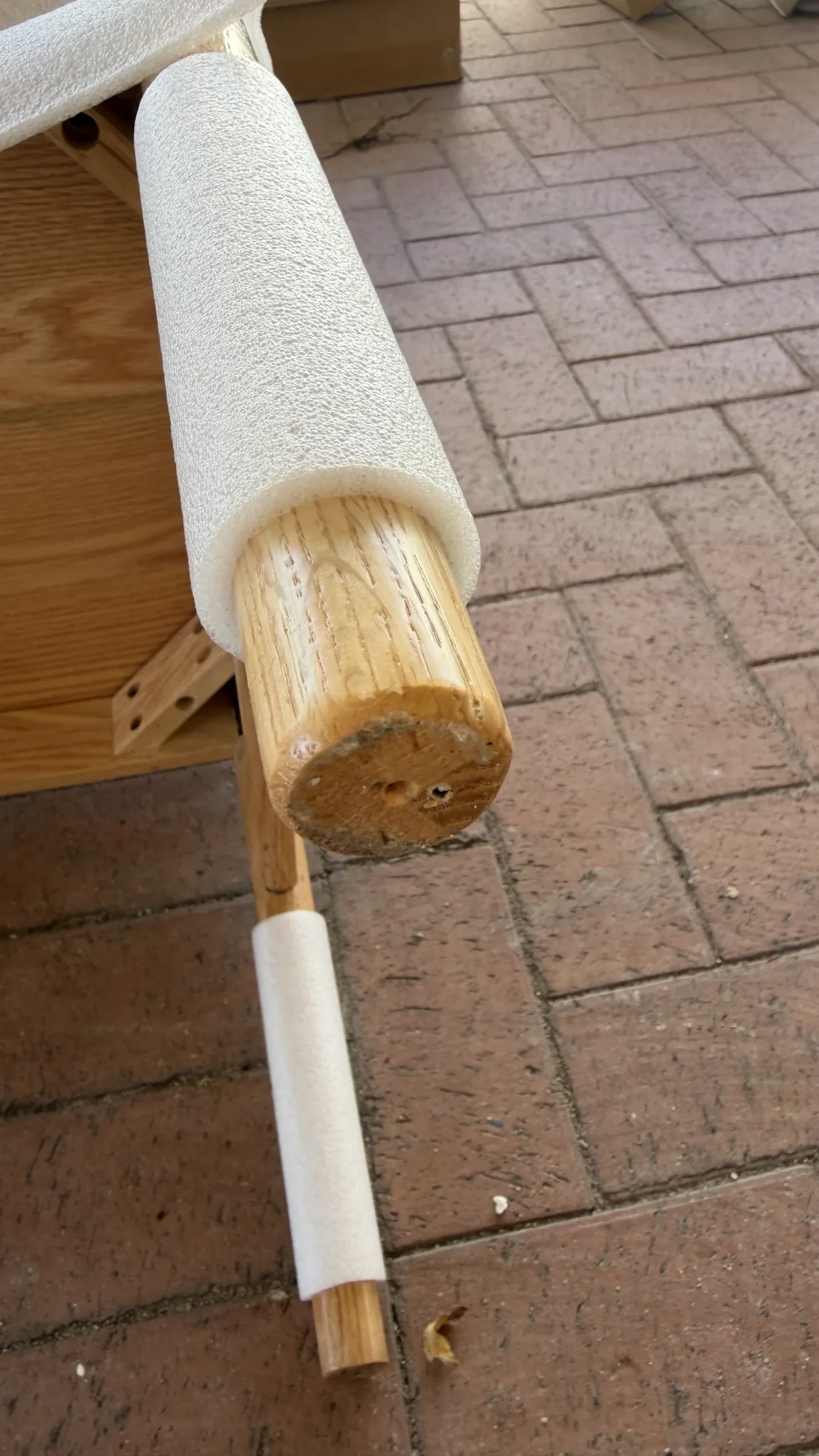 Another leg from the same shipment: foam protected the finish, but mould still grew on the exposed end grain.