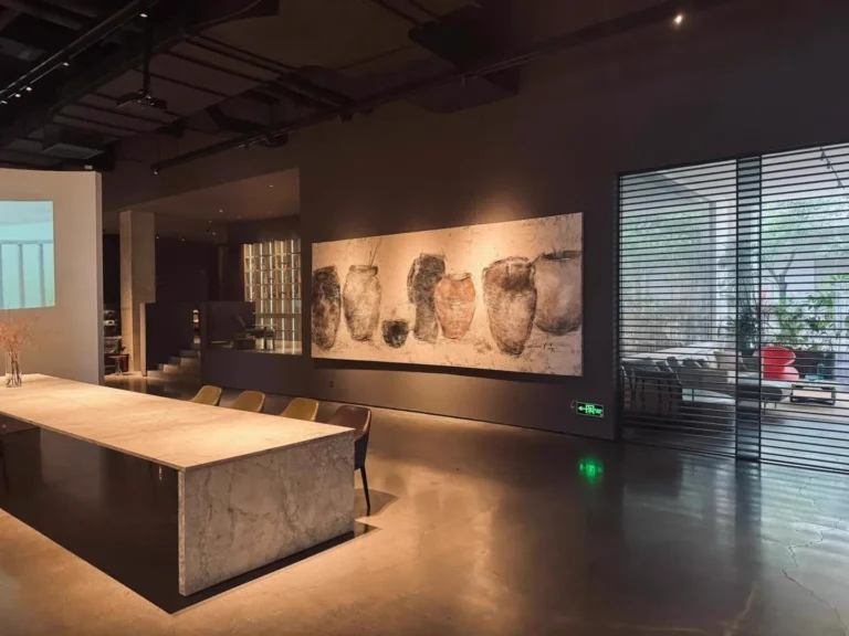 A Dongguan showroom with a long stone table and large artwork, from a buyer's three-day review of the city's high-end furniture showrooms.