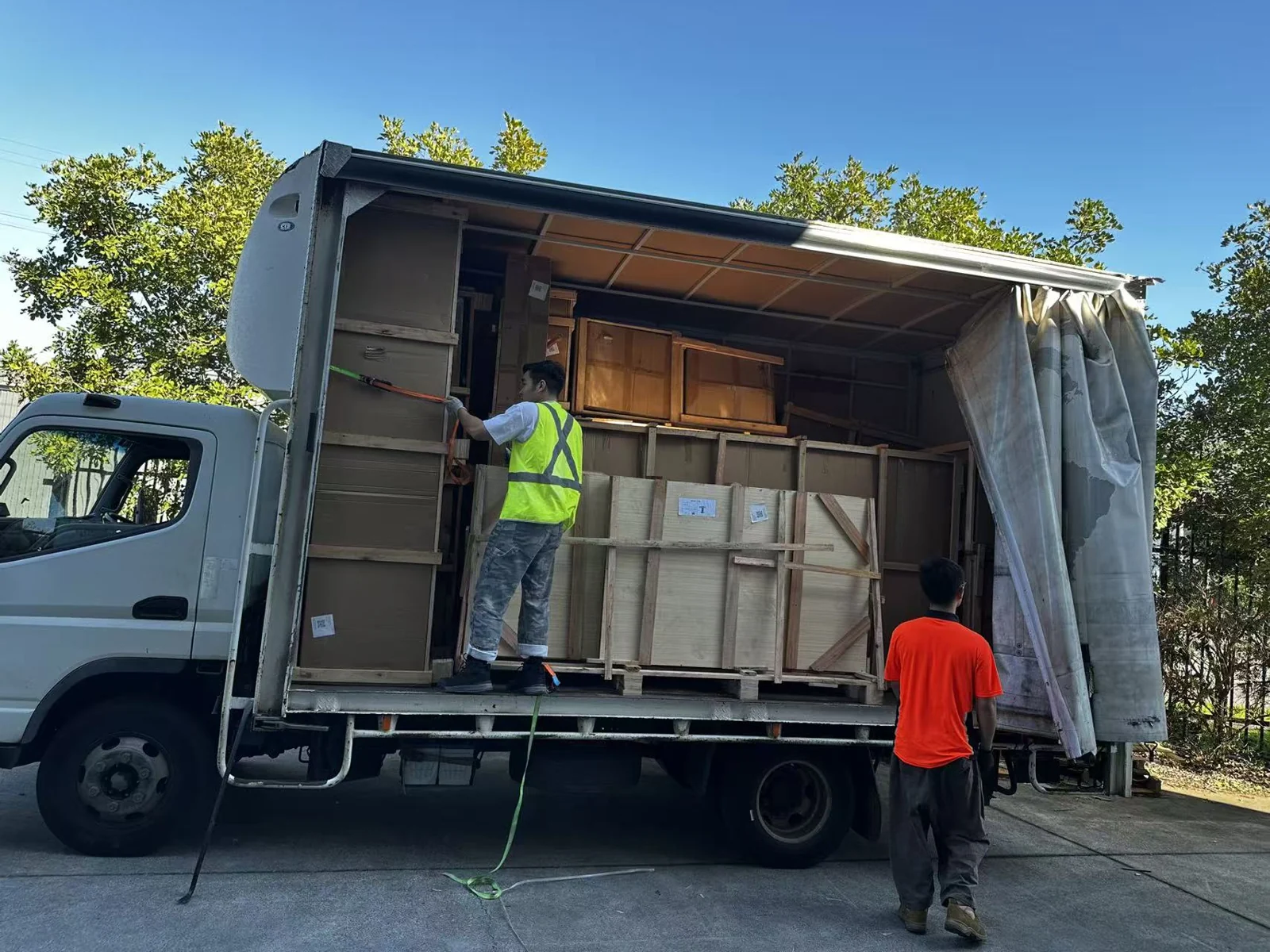 Crated furniture in a curtain-side truck during the Melbourne delivery