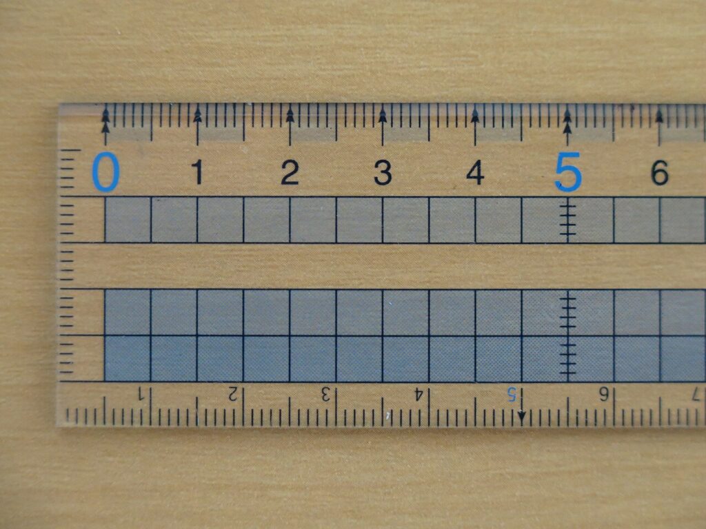 Unrelated ruler illustrating a dimensional line that must be checked against the target brief