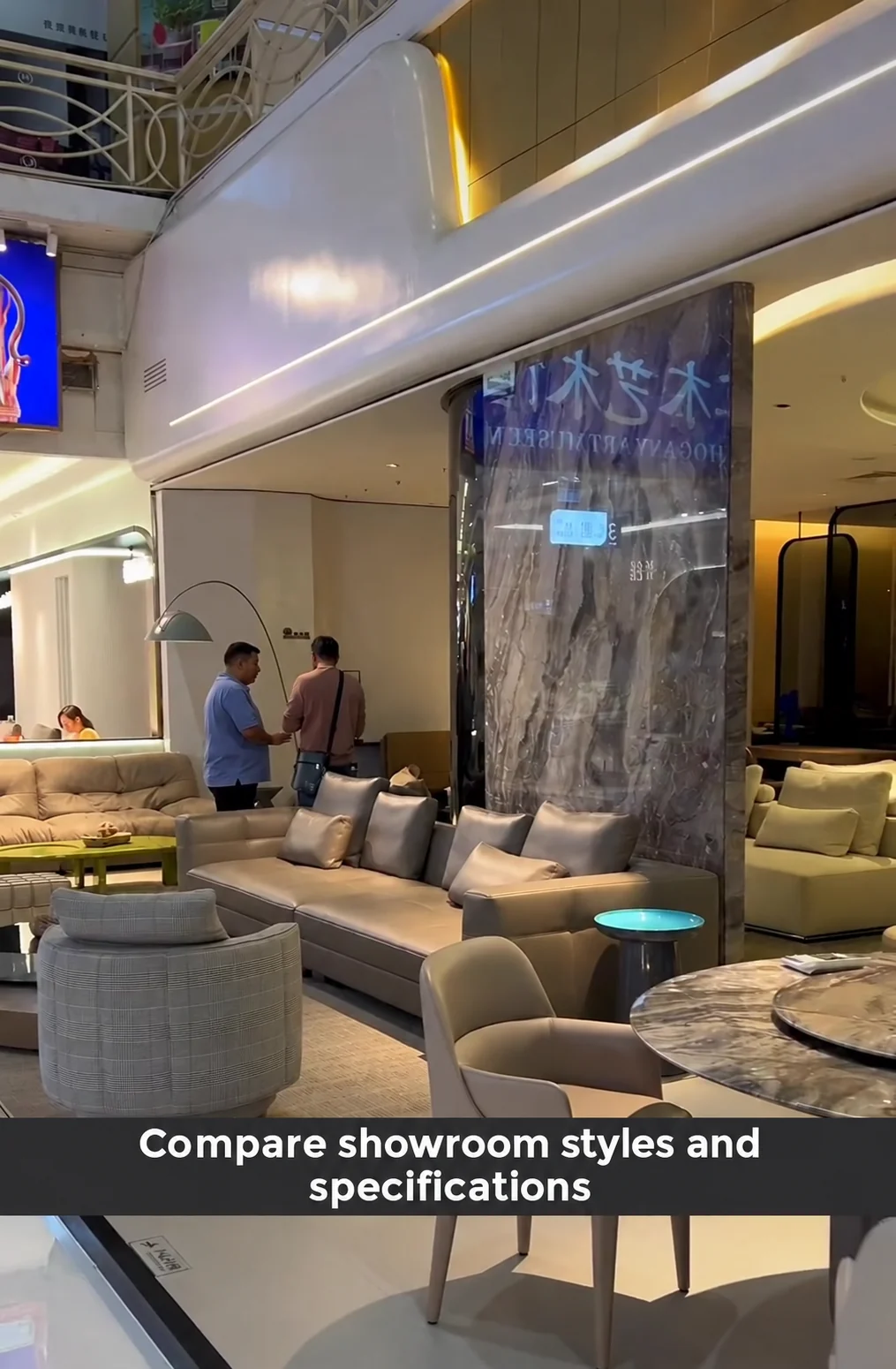 Sofas, a lounge chair and dining furniture in a showroom.