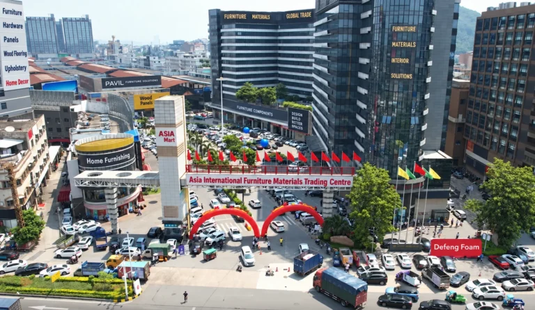 Aerial view of the materials-market district in Longjiang, posted by the market operator: trading halls, foam and fabric traders and lorries loading.