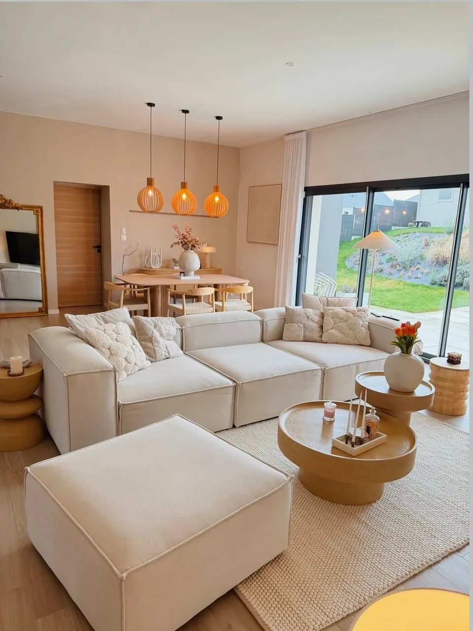 Australian living room with a cream sectional sofa and round coffee table