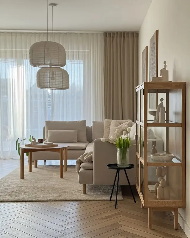 Bremen living room with cream upholstery, wood-finish furniture and light curtains