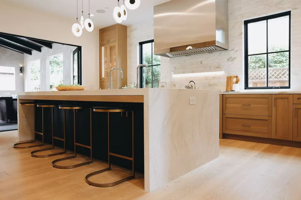 Slim dark stools along the kitchen island in the Menlo Park home