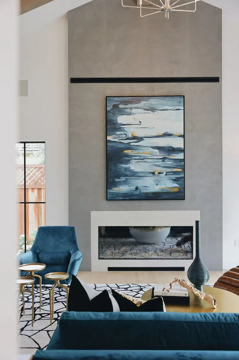 Blue upholstered seating and a timber coffee table in the Menlo Park living room