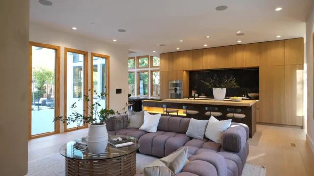 Open-plan living room and wood-tone kitchen cabinetry in Palo Alto