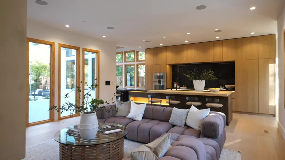 Open-plan living room and wood-tone kitchen cabinetry in Palo Alto
