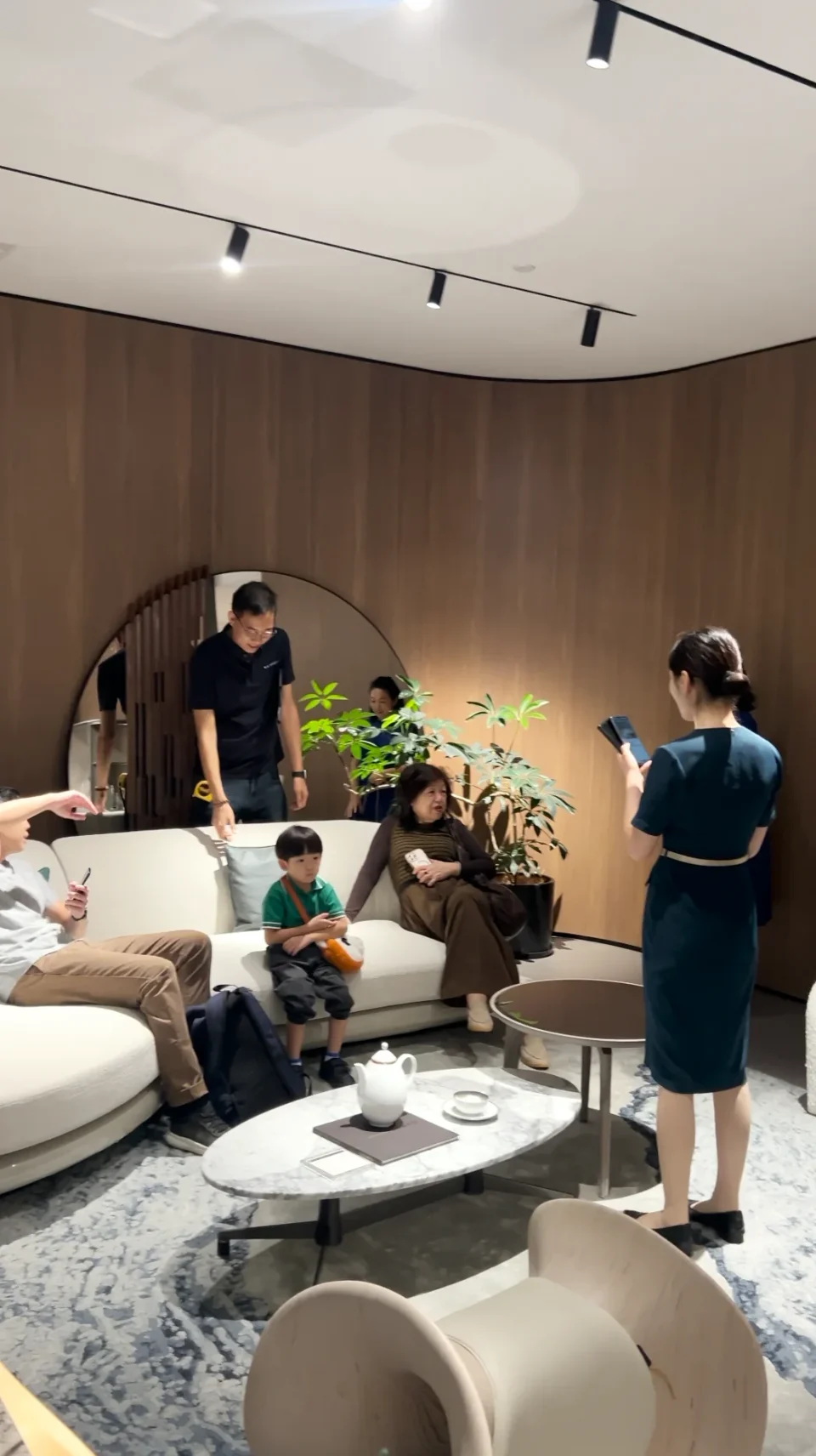 Visitors comparing sofas with showroom staff in Foshan.