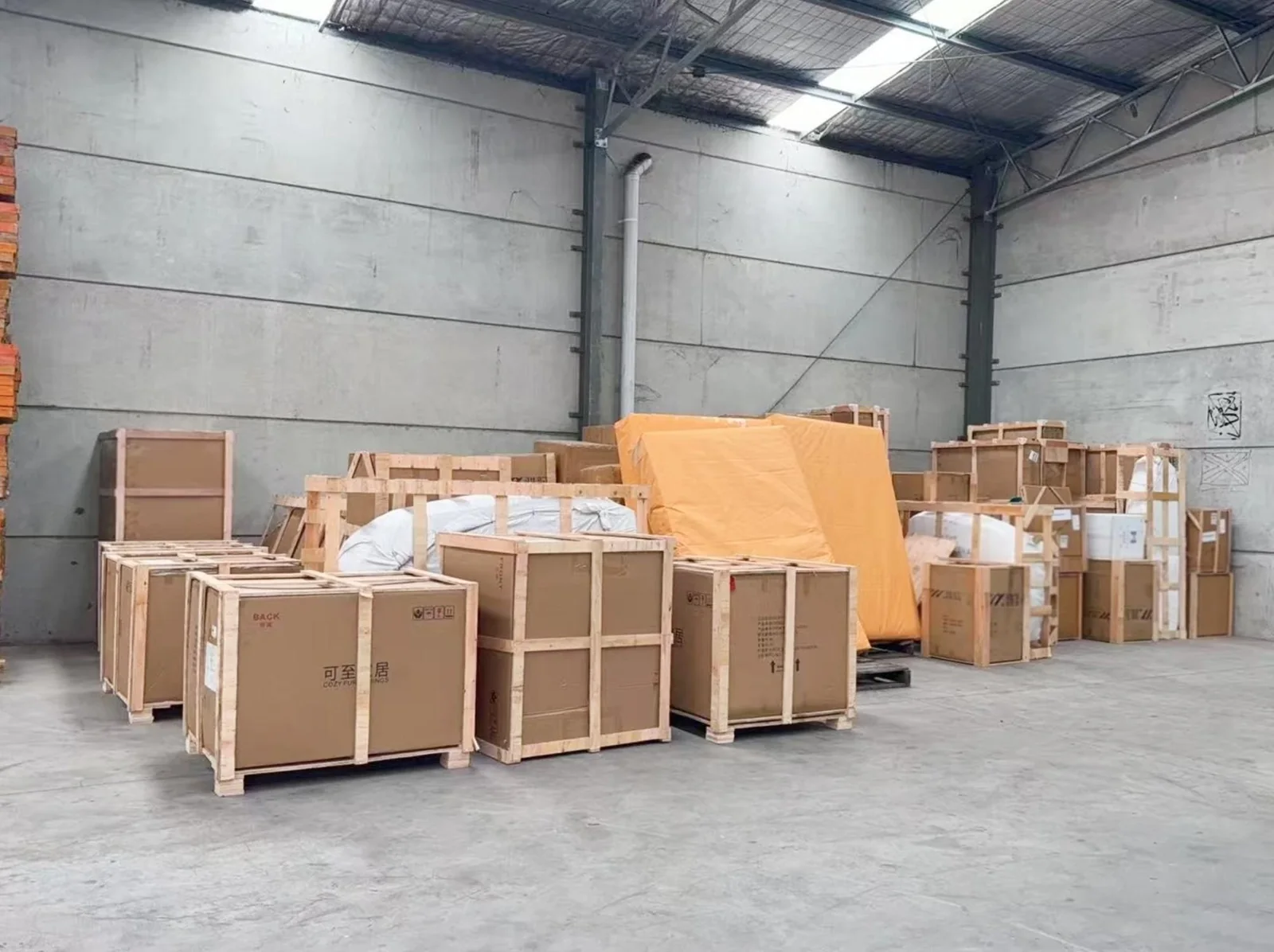 Furniture cartons protected with timber frames in the warehouse for Source Foshan's Sydney project
