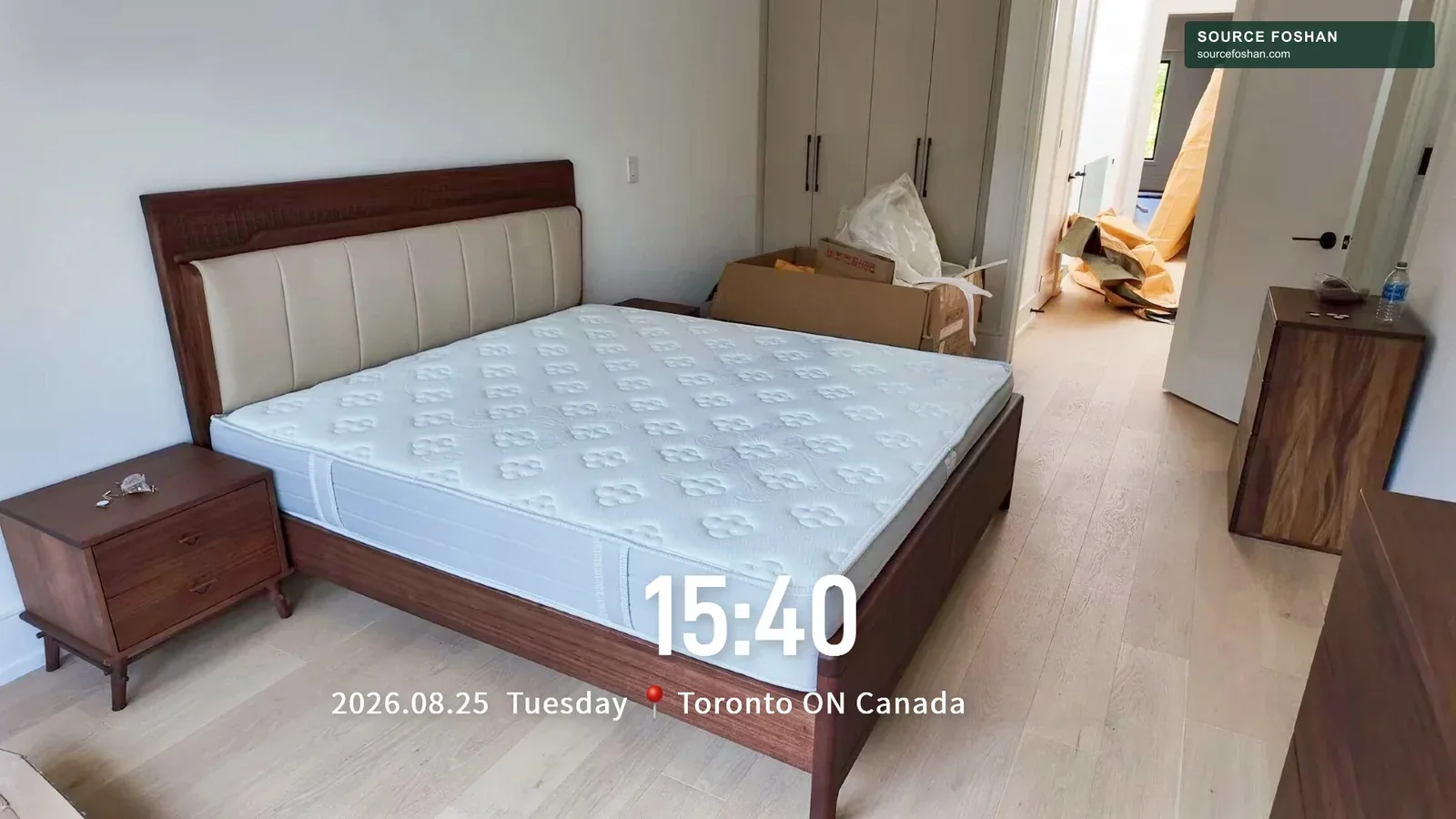 Bed, mattress and bedside furniture placed in a Toronto bedroom